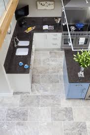 Several variations can be implemented in the borders and angles of the pattern here we see unique kitchen floor tiles in earthy colours that resemble natural stone and comprise different shades of beige from light to dark. Silver Tumbled Travertine Tile Mandarin Stone Stone Tile Flooring Kitchen Remodel Small Room Flooring