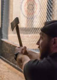 With one hand (the one that has been chalked), grip the axe at the bottom of its handle. Batl In Novi Hits The Bullseye With Ax Throwing Fans