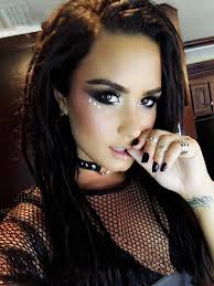 The messy fishtail braid looks so adorable and pretty. Pics Demi Lovato S Dreadlocks New Hairstyle For No Promises Music Video Hollywood Life