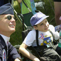 US Air Force (USAF) Captain (CAPT) Chris Stricklin, from the USAF  Thunderbirds watches an aerial demonstration with young cancer survivor  Andrew Sowles, at Selfridge Air National Guard (ANG) Base, Michigan (MI) -