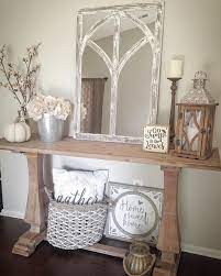 A cozy vintage meets rustic entryway with a woodne console, some metal suitcases, a metal monogram and a basket for storage. Pin On Home Decor