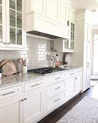 Maybe you would like to learn more about one of these? White Kitchen Shaker Cabinets With Grey Subway Tile Backsplash Glass Front Cabinets White Shaker Kitchen Cabinets White Shaker Kitchen Kitchen Renovation