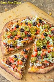 Easy Taco Pizza Homemade Pizza Topped With Your Favorite Taco Ingredients Like Meat Peppers Olives Tomatoes Ch Pizza Toppings Food Pizza Recipes Homemade