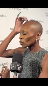 Cynthia Tapping Her Bald Head