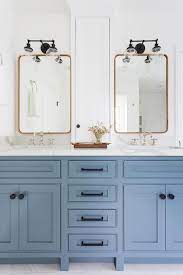 Single vanity in maple gray with marble vanity top in carrara white. A Blue Double Washstand Is Accented With Oil Rubbed Bronze Hardware And A White Quartz Count Bathroom Vanity Designs Bathroom Addition Modern Bathroom Cabinets