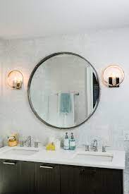 If the main person or people using this bathroom are significantly shorter or taller so they would not benefit from this placement, adjust the sconce height to accommodate their needs. The Right Height For Your Bathroom Wall Sconce