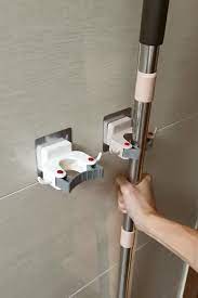 Why waste valuable storage closet space storing mops and brooms when you can. Mop Holder Locker Video Diy Home Cleaning Home Decor Hooks Mop Holder