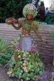 The garden was the idea of jessica moyes, who is the art teacher at sharon elementary. 16 Unusual Garden Decorations To Add Fun In Your Backyard The Art In Life Garden Figures Succulent Topiary Garden Art