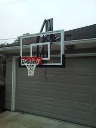 Be sure that the place where you're installing the basketball hoop is free and clear of any mechanisms around the garage door area. Roof Master Roof Mount Basketball System From Dunrite Playgrounds Http Www Dunriteplaygrounds Com Home Basketball Court Backyard Basketball Hoop Driveway