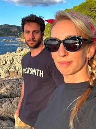 Aaron Taylor-Johnson, 34, and his wife Sam, 57, link arms as they step out  during PFW after sharing jaw-dropping beach snaps