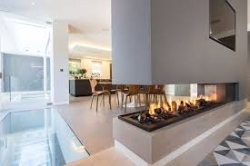 This Stunning Three Sided Gas Fireplace Forms Part Of A Room Divider Divider In 2020 Open Plan Kitchen Living Room Gas Fireplace Living Room With Fireplace