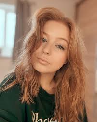 Maltese dogs Josie and Tessa in a red car bed