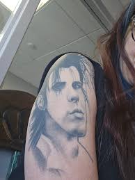 Does getting a tattoo of a handbell score violate copyright laws?