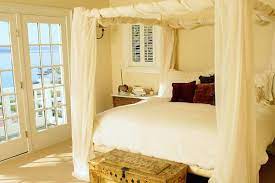 If your bed has a structured canopy, simply hang a large, hemmed cut of fabric over the top frame rails to create your canopy bed. What Kind Of Fabric For Bed Canopy How Much How To Tips