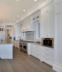 Shaker Style Cabinet The Kitchen Features Shaker Style Cabinet With Beaded Face Fra Kitchen Cabinet Remodel White Shaker Kitchen White Shaker Kitchen Cabinets