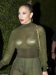 Jennifer lopez's green versace dress at the 2000 grammy awards was one of the most iconic dresses in fashion history. Jennifer Lopez Flashes Her Bra With Sheer Green Dress Daily Mail Online