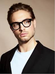 Confident Man Glasses Suit Studio Portrait