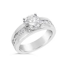 Channel settings are one of the most common engagement ring designs, but they are also one of the most beautiful. Modern Engagement Ring With Round Diamond The Diamond Guys