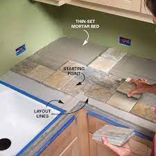 Remove the tiles from a section of the countertop and apply a layer of thinset to the cementboard substrate using a notched trowel. Installing Tile Countertops Ceramic Tile Kitchen Countertops Diy