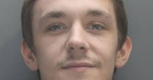 Gangster's errand boy winks and cheers in court at his…