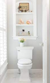 A height of 2 feet above your toilet is the perfect distance. Inset Custom Shelves Over Toilet Transitional Bathroom