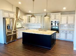 white kitchen with black island