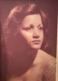 Hi can anyone remove the baby please? Would like to use this photo of my  mother in law for her funeral service, thanks.