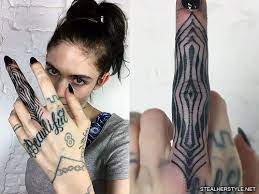 The fingers of grimes' left hand are inked beautifully. Grimes 18 Tattoos Meanings Steal Her Style