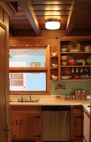 A Knotty Pine Kitchen Respectfully Retained And Revived Knotty Pine Kitchen Pine Kitchen Pine Kitchen Cabinets