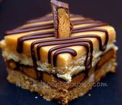 Peanut Butter Cheesecake Over Peanut Butter Cups Sitting On A Graham Cracker C Peanut Butter Recipes Peanut Butter Cheesecake Bars Peanut Butter Cup Cheesecake