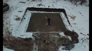 The idea behind this project is to dig a trench in the ground that's large and deep enough to suit your needs, and to use logs or telephone poles for covering it, as a roof of some sort. Digging A Foundation And Pouring A Footing Youtube