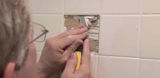 Removing Tile In Bathroom Wall Using A Cold Chisel And Hammer To Remove A Ceramic Tile Cheap Ceramic Tiles In Ceramic Tile Pictures To Pin On Pinterest How To Remove Bathroom Tile