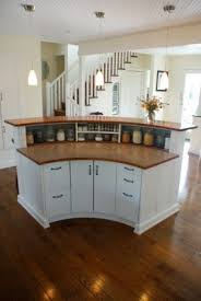 Curved overhangs, island structures and more. Rounded Kitchen Island From The Back Curved Kitchen Curved Kitchen Island Kitchen Design
