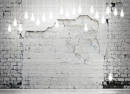Black And White Brick Wall Background Distressed White Brick Wall With Hanging Light Bulbs White Brick Walls Light Brick Wall Hanging Lights