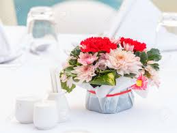 Maybe you would like to learn more about one of these? Close Up Chrysanthemum And Carnation Flower Bouquet And Polyscias Leaf Decoration On Dining Table Stock Photo Picture And Royalty Free Image Image 51776230