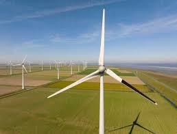 Experimental wind turbine with one blade painted black to reduce collisions  with birds stock photo