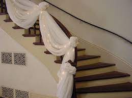 Before beginning, envision how you want the stair rail to look when it's completely decorated so that you can adjust the tulle as. Double Staircases Decorated For Christmas Washington County Mn Official Website Wedding Planning Wedding Staircase Stair Decor Wedding Altars