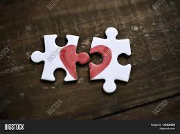 Maybe you would like to learn more about one of these? Closeup Of Two Separated Pieces Of A Puzzle Which Together Form A Heart On A Rustic Wooden Surface Image Stock Photo 172204520