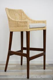 Smaller strands of rattan or on a few styles water hyacinth or seagrass is used to weave over the rattan frames on the seat areas. Handcrafted French Design Wooden And Rattan Bar Stool For Sale At 1stdibs