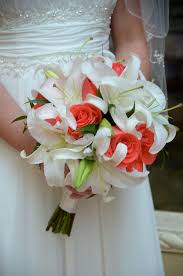 Join us for basic floral design online and become a certified floral designer. Beach Wedding Hand Tied Bridal Bouquet Of White Casablanca Lilies And Coral Rose Flower Bouquet Wedding Wedding Bouquets Pictures Beach Wedding Flowers Bouquet