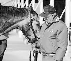 holy bull with his trainer jimmy croll thoroughbreds