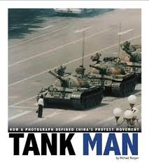 Tank man , or the unknown protester , is the nickname of an anonymous man who stood in front of a column of tanks on june 5, 1989, the morning after the chinese military had suppressed the tiananmen square protests of 1989 by force. Tank Man How A Photograph Defined China S Protest Movement By Michael Burgan