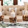 Crafted from solid wood, each section of the candlestick features intricate woodwork that culminates in a steady, wider base. 1