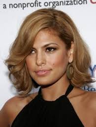Her hair is parted off center on the left side and has some height in the crown area. Eva Mendes Hairstyles Celebrity Haircuts