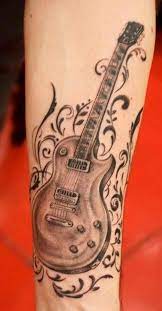 Explore designs with harmony and vocal pizzazz. Gibson Guitar Tattoo By Khoi Nguyen Guitar Tattoo Design Music Tattoos Music Guitar Tattoo