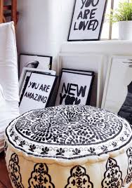You can stuff it with bean bag filling, old shirts, blankets, etc. Black And White Embroidered Pouffe Mad About The House