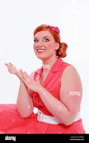 Young red-haired woman with voluptuous curves Stock Photo - Alamy