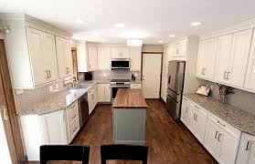Topping off the kitchen island is maple butcher block. Cream Kitchen With Green Island With Butcher Block Countertop Contemporary Kitchen Cleveland By Cabinet S Top Houzz