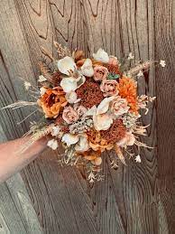 From bright red and fuchsia, to dusty pink and rich mauve, it's easy to incorporate the colors of fall into your wedding decor. Rustic Boho Burnt Orange Wedding Bouquet Bridal Bouquet Fall Wedding Inspiration Fall Bridal Bouquet