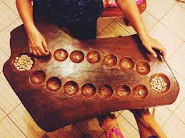 Sungka Mancala Variant Of The Philippines Sungkaan Couple Halloween Costumes For Adults Pirate Halloween Costumes Traditional Games